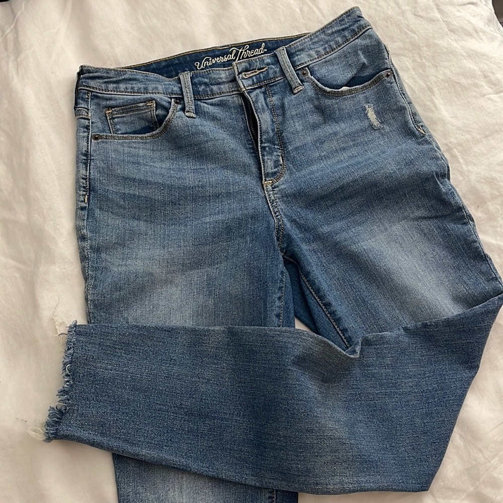 High rise skinny jeans with distressed hem